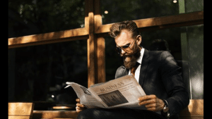robo advisor news - man reading the newspaper